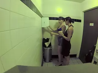 Three bitches are in someone's skin public bathroom, shellacking acquainted