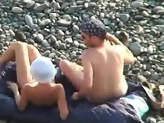 Voyeur on public beach. Oral sex